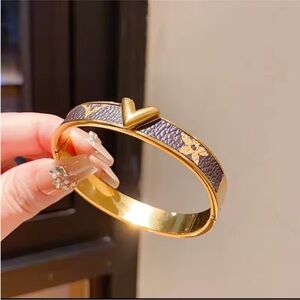 LV Gold and Brown Bracelet with Heart Detail